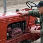 What are the steps to start a tractor?